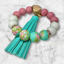 Load image into Gallery viewer, Teal and Pink Floral Silicone Beaded Wristlet