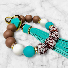Load image into Gallery viewer, Teal and Brown Cow Print Silicone Beaded Wristlet