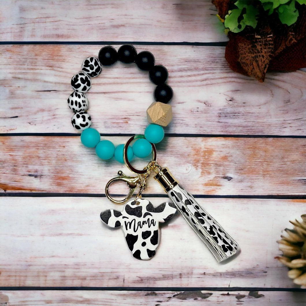 Teal And Black Cow Print Silicone Beaded Wristlet